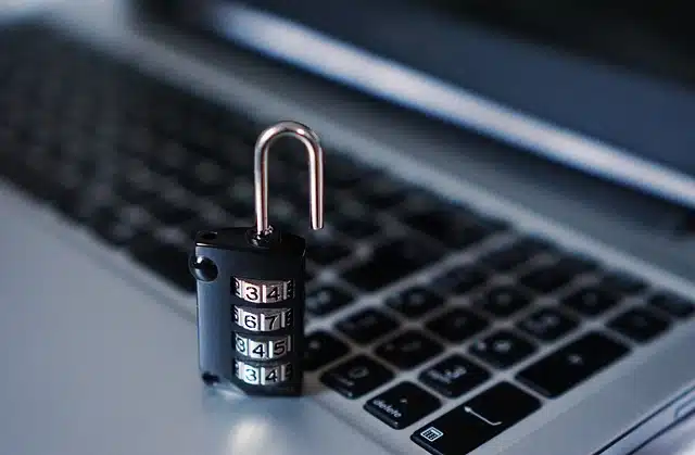 Combination lock on laptop, representing website security